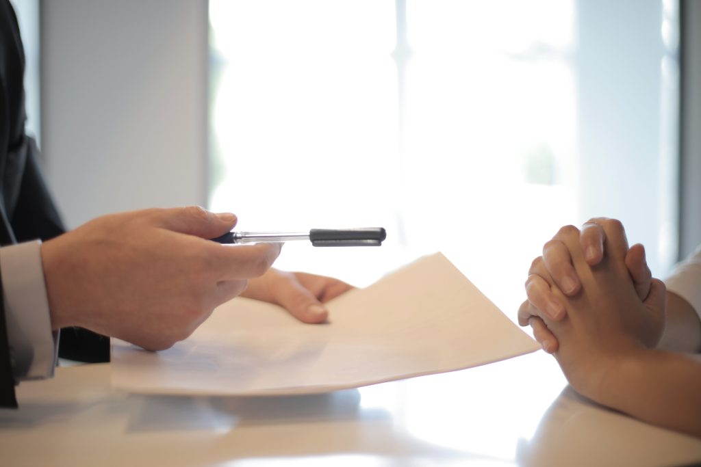 Advisor reviewing paperwork with a client